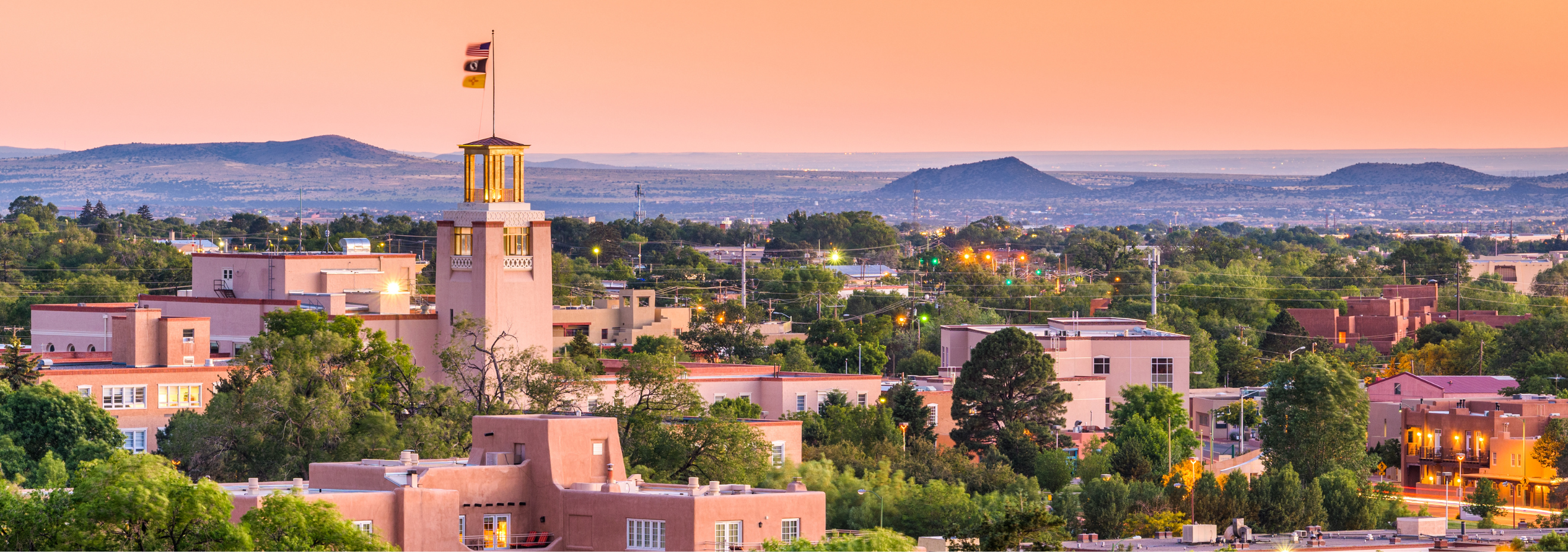 Image of Santa Fe, New Mexico skyline at dusk.